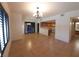 Spacious living room and open floor plan with tile flooring, natural light, and access to the kitchen at 9580 W Reno Ave # 183, Las Vegas, NV 89148