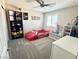 This bedroom features carpeted floors, a ceiling fan, and a window with natural light at , Las Vegas, NV 89135
