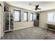 Bedroom with neutral decor, gray carpet, a ceiling fan and shuttered windows at , Las Vegas, NV 89135