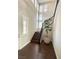 Bright entryway with dark wood floors, staircase and many vertical windows providing natural light at , Las Vegas, NV 89135