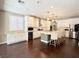 Bright kitchen boasts white cabinets, stainless steel appliances, and a large center island with pendant lighting at , Las Vegas, NV 89135