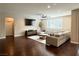 Open living room with wood floors, neutral decor, a ceiling fan, recessed lights and plantation shutters at , Las Vegas, NV 89135