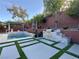 Backyard oasis featuring a modern pool, built-in grill, and beautiful landscaping for outdoor enjoyment at , Las Vegas, NV 89135