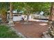 Large backyard is shaded by mature trees, and features low-maintenance landscaping at 1004 Yucca Ave, Las Vegas, NV 89104