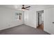 Bright, cozy bedroom with an abundance of natural light, a ceiling fan, and neutral carpeting at 1004 Yucca Ave, Las Vegas, NV 89104