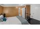Bedroom featuring black tile floors, wood panelling, and a door to the outside at 1004 Yucca Ave, Las Vegas, NV 89104
