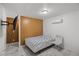 Bedroom featuring tile floors, a wall mounted television and neutral decor at 1004 Yucca Ave, Las Vegas, NV 89104