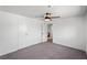 Spacious bedroom with neutral carpet, ceiling fan, and large closet at 1004 Yucca Ave, Las Vegas, NV 89104