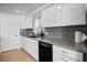 Renovated kitchen featuring gray quartz counters, stainless appliances, and white cabinets at 1004 Yucca Ave, Las Vegas, NV 89104