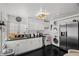 Bright kitchen boasts sleek white cabinets, black countertops, and stainless steel appliances at 1004 Yucca Ave, Las Vegas, NV 89104
