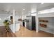 Bright, renovated kitchen with tiled floors, quartz counters, and stainless appliances at 1004 Yucca Ave, Las Vegas, NV 89104