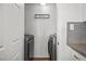Modern laundry room with side-by-side washer and dryer and neutral paint at 1004 Yucca Ave, Las Vegas, NV 89104