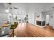 Open-concept living area with hardwood floors, large windows, and cozy fireplace at 1004 Yucca Ave, Las Vegas, NV 89104