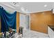 Bright office area featuring tile floors, neutral decor, and a white door at 1004 Yucca Ave, Las Vegas, NV 89104