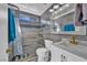 Bright bathroom with a step-in shower, and a vanity with marble countertop at 103 Trout Creek Ct, Las Vegas, NV 89123