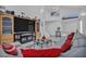 Open-concept living area featuring a large sectional, high ceilings, and marble floors at 103 Trout Creek Ct, Las Vegas, NV 89123