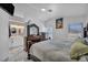 Cozy main bedroom with marble floors, a beautiful dresser, and an ensuite bathroom at 103 Trout Creek Ct, Las Vegas, NV 89123