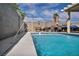 Backyard pool with a water feature and a patio area, perfect for outdoor entertainment and relaxation at 103 Trout Creek Ct, Las Vegas, NV 89123