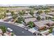 An aerial view highlights the community's proximity to the desert and tidy landscaping around homes at 10601 India Hawthorn Ave, Las Vegas, NV 89144