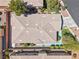 Home with a durable roof, landscaped yard, and a cozy outdoor area with a beautiful garden at 10601 India Hawthorn Ave, Las Vegas, NV 89144