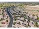 A peaceful community of single-Gathering homes is showcased in this aerial view, with desert surroundings at 10601 India Hawthorn Ave, Las Vegas, NV 89144