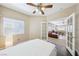 Bedroom with French doors that lead to an open living space at 10601 India Hawthorn Ave, Las Vegas, NV 89144