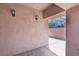 Inviting covered entrance featuring stylish exterior lighting and textured walls, perfect for a warm welcome at 10601 India Hawthorn Ave, Las Vegas, NV 89144
