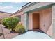 Inviting front entrance with desert landscaping and a covered porch at 10601 India Hawthorn Ave, Las Vegas, NV 89144
