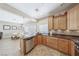 Open-concept kitchen features stainless steel appliances and tile flooring at 10601 India Hawthorn Ave, Las Vegas, NV 89144