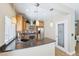 Modern kitchen with stainless steel appliances, stone counters, and pendant lighting at 10601 India Hawthorn Ave, Las Vegas, NV 89144