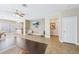 Bright living space with ceiling fan, neutral color scheme, and tile flooring at 10601 India Hawthorn Ave, Las Vegas, NV 89144