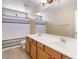 Bright bathroom with double sink vanity, framed mirror and shower with curtain at 11219 Castellane Dr, Las Vegas, NV 89141