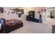 Spacious bedroom with neutral walls, lots of posters, and a dedicated desk and workspace at 11219 Castellane Dr, Las Vegas, NV 89141