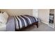 Bedroom with a comfy queen-sized bed, soft carpet, and a full length mirror at 11219 Castellane Dr, Las Vegas, NV 89141