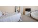 Light bedroom featuring neutral walls, a comfortable chair, and a serene ambiance at 11219 Castellane Dr, Las Vegas, NV 89141
