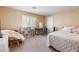 Bright bedroom featuring neutral walls, a comfortable chair, and a serene ambiance at 11219 Castellane Dr, Las Vegas, NV 89141