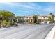 Gated community entrance with lush landscaping and well-maintained surroundings at 11219 Castellane Dr, Las Vegas, NV 89141