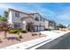 Charming two-story home with a well-manicured front yard, complemented by a long driveway at 11219 Castellane Dr, Las Vegas, NV 89141
