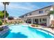 An inground pool featuring mature landscaping, covered patio and lots of room to relax at 11219 Castellane Dr, Las Vegas, NV 89141