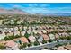 An aerial view captures the neighborhood, displaying a network of streets, houses, and the mountain view in the distance at 11618 Costa Linda Ave, Las Vegas, NV 89138