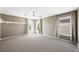 Spacious bedroom with large windows, plush carpet, and ceiling fan for a light and airy feel at 11618 Costa Linda Ave, Las Vegas, NV 89138