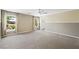 Bright bedroom featuring large windows, plush carpet, and natural light at 11618 Costa Linda Ave, Las Vegas, NV 89138