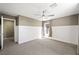 Bedroom with wainscoting, plush carpet, and a ceiling fan, creating a comfortable and inviting space at 11618 Costa Linda Ave, Las Vegas, NV 89138