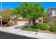 Charming single-story home featuring a well-maintained front yard and a two-car garage at 11618 Costa Linda Ave, Las Vegas, NV 89138