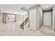 Hallway and staircase with neutral paint and tile flooring at 11618 Costa Linda Ave, Las Vegas, NV 89138