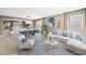 Open-concept living room and dining area with stylish decor, plenty of natural light, and a comfortable seating arrangement at 11618 Costa Linda Ave, Las Vegas, NV 89138