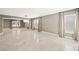 Spacious open floor plan with tile flooring and large windows with natural light at 11618 Costa Linda Ave, Las Vegas, NV 89138