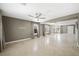 Large living area showcases tile floors, neutral paint, and large windows with natural light at 11618 Costa Linda Ave, Las Vegas, NV 89138