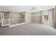 Upstairs loft with neutral walls, plush carpet, and large windows letting in natural light at 11618 Costa Linda Ave, Las Vegas, NV 89138