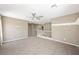 Open loft area with neutral walls, plush carpet, and a ceiling fan for added comfort at 11618 Costa Linda Ave, Las Vegas, NV 89138